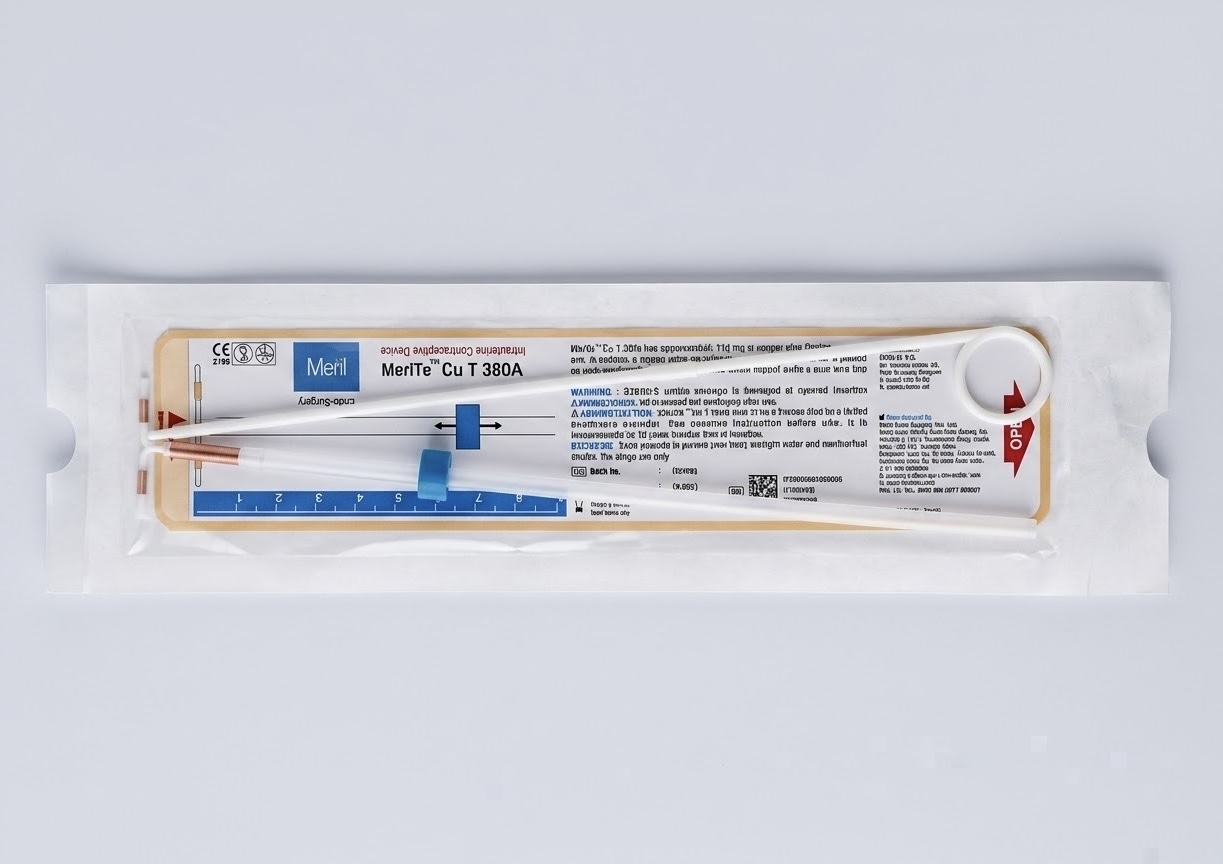 Sterile copper and hormonal IUD packaging on a clean medical countertop