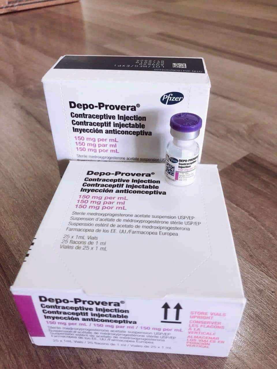 Depo-Provera DMPA contraceptive injection boxes and vial on a clean medical surface